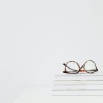 Glasses enhancing reading with adjustable lenses