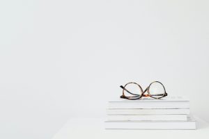 Glasses enhancing reading with adjustable lenses