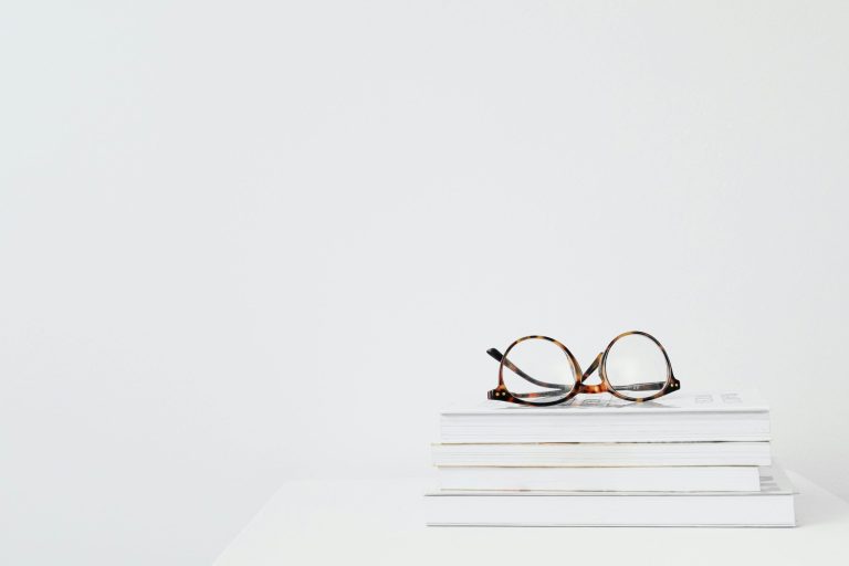 Glasses enhancing reading with adjustable lenses